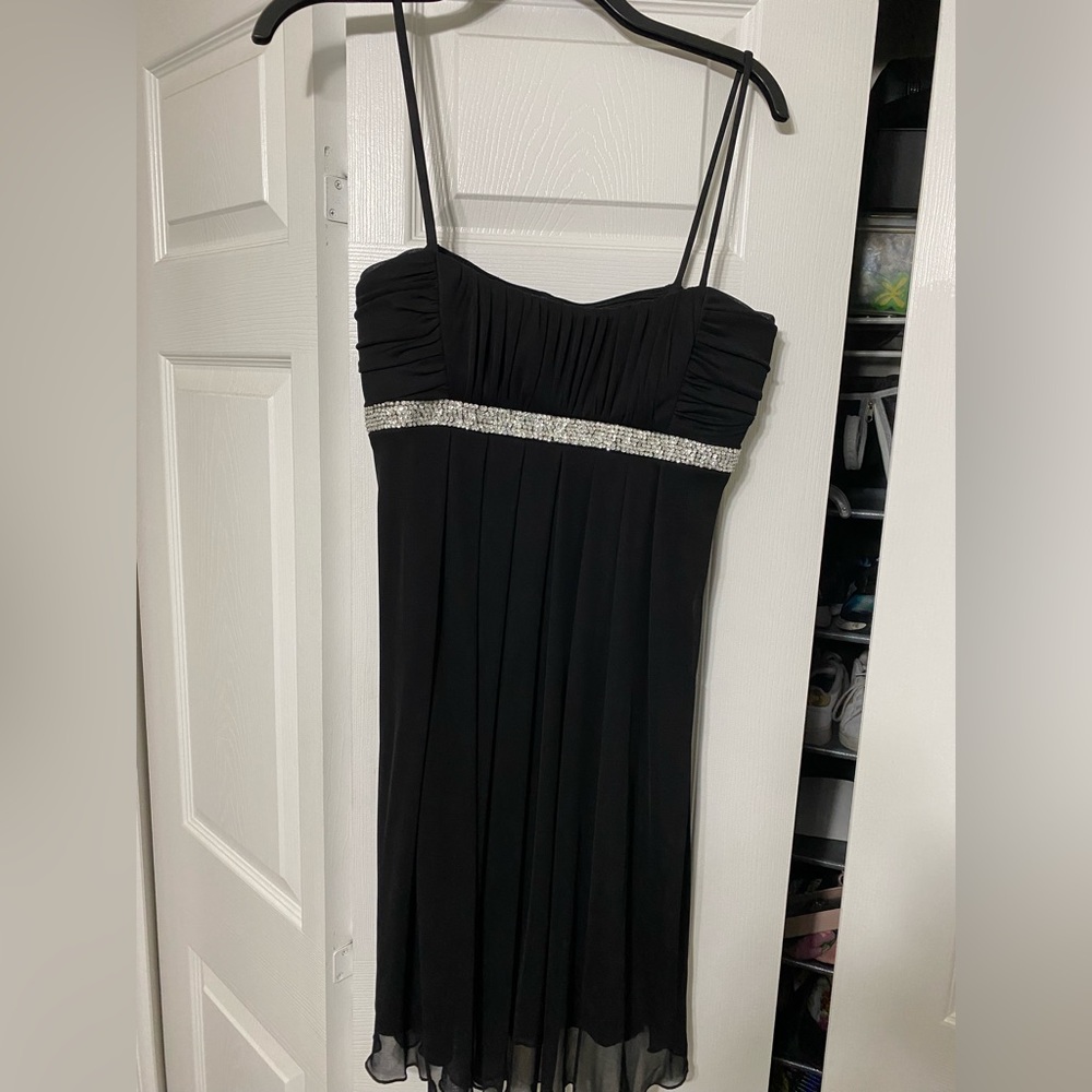 This is a black formal dress by Jodi Kristopher in a size large.l